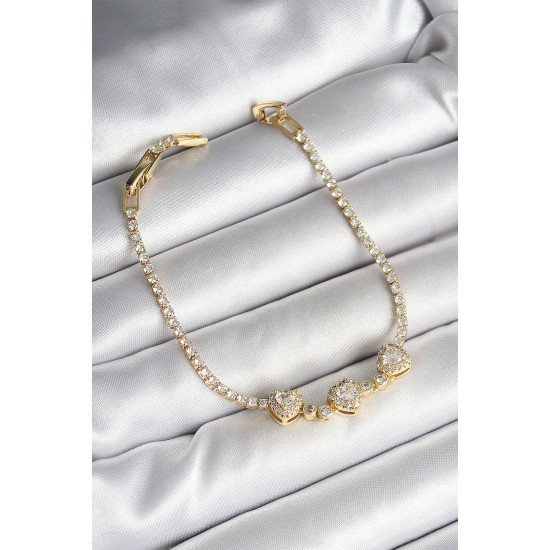 Pirinç Sıralı Kalp Figürlü Zirkon Taşlı Gold Renk Kadın Bileklik Pirinç Sıralı Kalp Figürlü Zirkon Taşlı Gold Renk Kadın Bileklik